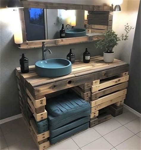A Bathroom Vanity Made Out Of Wooden Pallets With A Blue Sink And