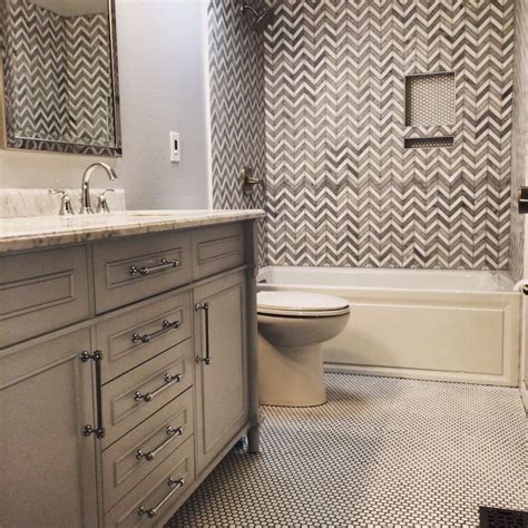 They can be all one color, a rainbow of colors, or a carefully arranged pattern of just one or two colors. Chevron shower tile. Double vanity. Penny tile floor - Yelp