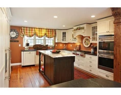 We are committed to offering high quality cabinets at the most competitive and affordable price, while providing exceptional customer service every step of the way. Kitchen with ivory cream cabinets and burnt orange pumpkin walls ... | Orange kitchen walls ...