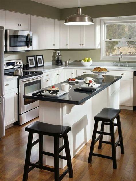 Browse a wide variety of kitchen island designs a mobile kitchen island makes a great addition to smaller kitchens that might not have room for a typical island as they a moveable kitchen island costs less than a permanent island, as well. Small Kitchen Island Ideas: 20+ Inspiring Designs on a ...