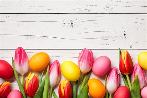 Fresh Colorful Tulips And Easter Eggs On Wooden Background Stock Photo