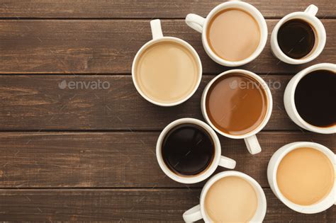 Different Types Of Coffee In Cups On Wooden Table Top View Stock Photo