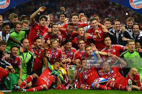 Maybe you would like to learn more about one of these? Bayern Muenchen players celebrate victory with the trophy ...