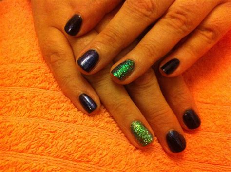 Black Gelish with iridescent sparkle and accent nail done white sparkle