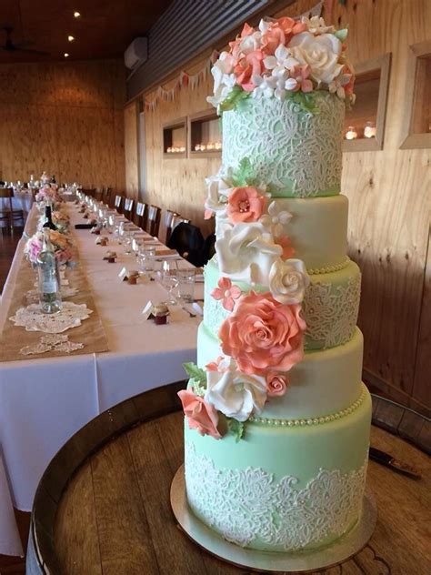 Green And White Fondant Wedding Cake With White And Orange
