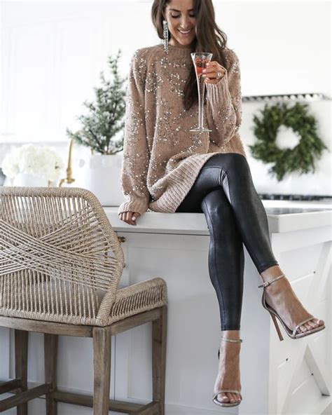 A Tan Embellished Sweater Black Leather Leggings And Tan Shoes For A
