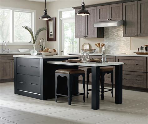 The purestyle finish on these brellin white laminate kitchen cabinets creates a look that is easy to love and equally easy to clean. Off White Cabinets with a Dark Wood Kitchen Island ...