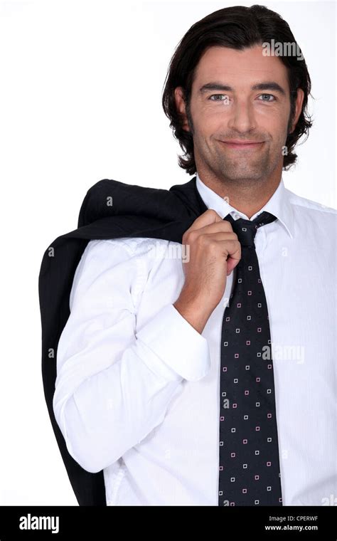 Smiling Businessman With His Jacket Over His Shoulder Stock Photo Alamy