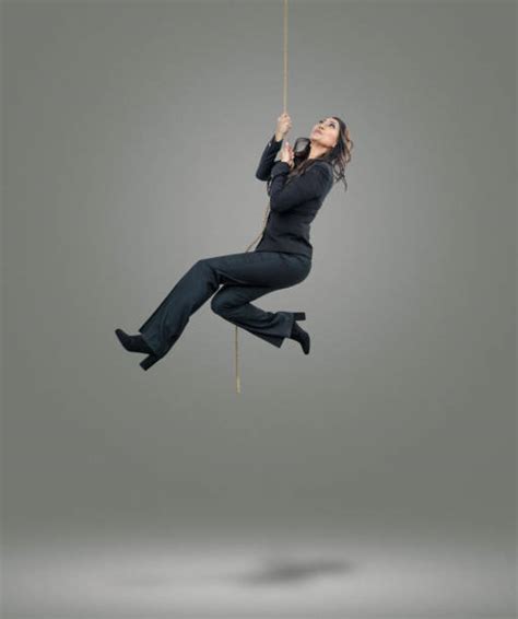 Woman Hanging Rope Stock Photos Pictures And Royalty Free Images Istock