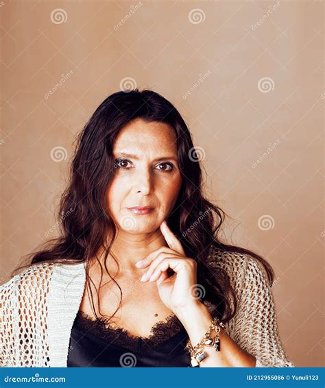 Pretty Brunette Confident Mature Woman Posing Cheerful On Warm Brown Background Lifestyle