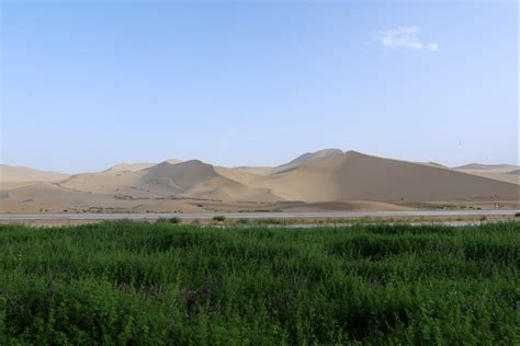 Stunning Scenery Of Echoing Sand Dunes With Crescent Lake Cgtn