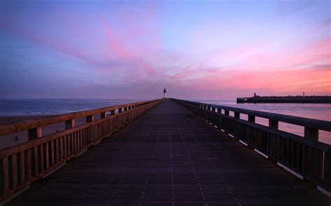 Download Wallpaper 2560x1600 Pier Lighthouse Horizon Dawn Sea Sky