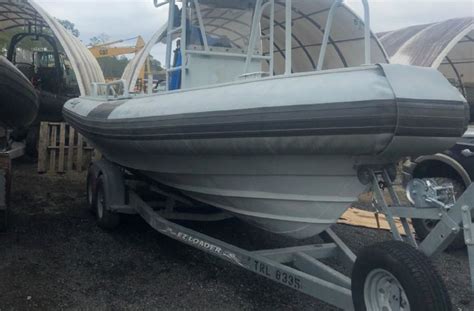 Bay style center console fishing boat with shallow draft hull boat cover. Military Boats/Vehicle Sales | KCLM Sales