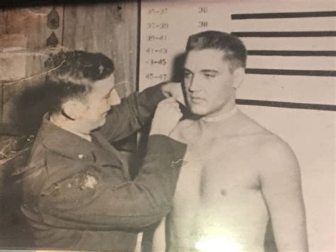 Maybe you would like to learn more about one of these? Elvis Presley getting neck measured during height/weight ...