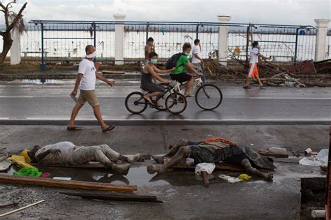 as the living receive aid bodies remain uncollected in the philippines the new york times