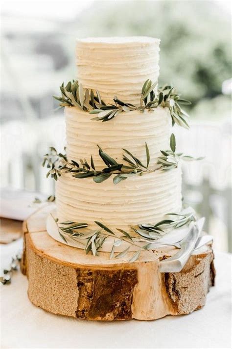 Simple white buttercream wedding cake with white roses and greenery. 20 Trending Simple and Rustic Wedding Cakes | Wedding cake ...