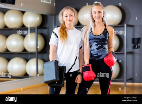 Portrait Of Two Women At Boxing Training In Fitness Gym Stock Photo Alamy