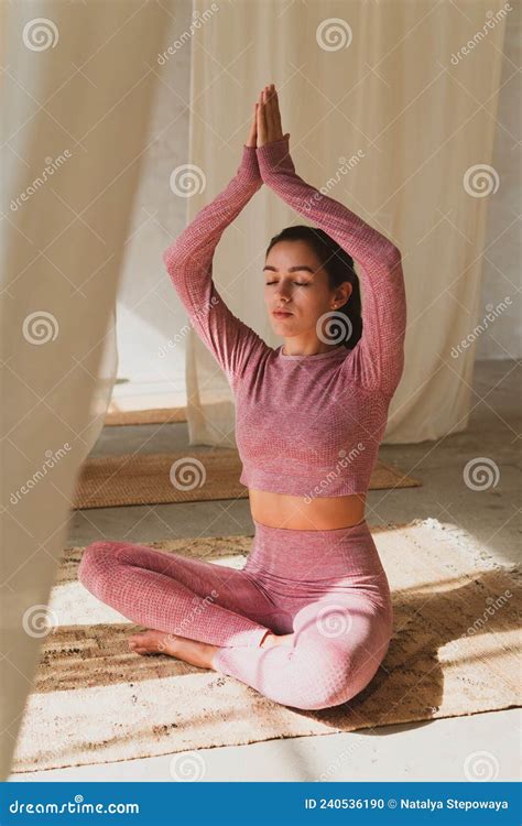 Young Beautiful Flexible Woman Doing Yoga Stretching In A Cozy Sunny