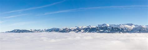 Fantastic Panoramic View Of Snow Mountain Range Stick Out Of Inversion