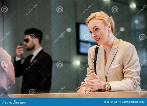 Polite Businesswoman Talking To Receptionist In Stock Image Image Of
