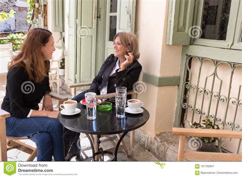 Two Women Having Coffee Outdoors Stock Image Image Of People