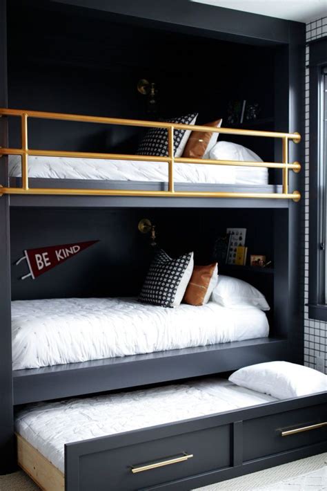 A Bunk Bed With Two Sets Of Drawers Underneath It And Some Pillows On