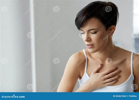 Beautiful Female Suffering From Painful Feeling Pain In Chest Stock
