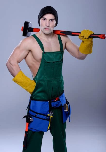 premium photo handsome topless construction worker with sledge hammer