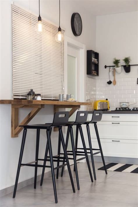 A scandinavian kitchen with a small tabletop and what are some good wordpress themes/plugins that allow you to manipulate design? 25 Breakfast Bar Ideas For Tiny Kitchens | ComfyDwelling.com