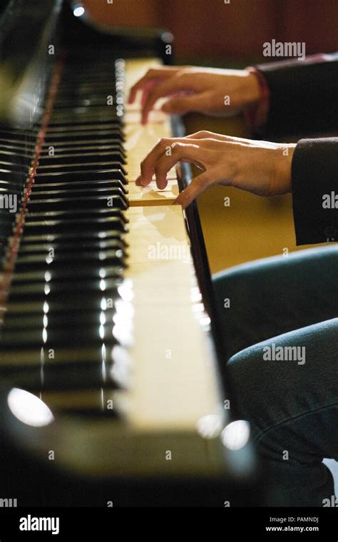 Pianists Hands Playing A Grand Piano Stock Photo Alamy
