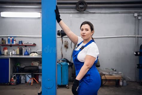 Female Mechanic In Work Clothes Posing In A Garage Stock Photo Image