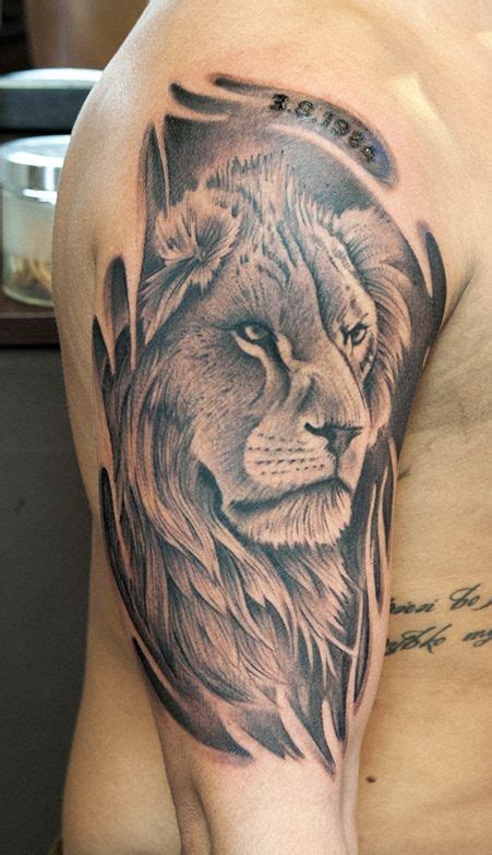 #lion tattoo #black tattoo #chest tattoo #male tattoo. Black and gray lion head tattoo on half sleeve - Tattooimages.biz