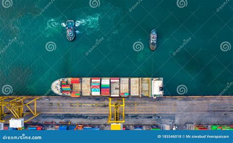 Aerial Top View Container Ship At Terminal Seaport With Tugboat Global