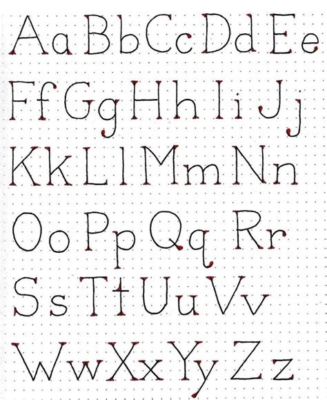 The Upper And Lower Letters Are Drawn In Red Ink On A Sheet Of White Paper