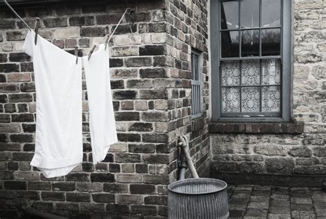 Posterazzi Stone Walls Of A House With Laundry Hanging To Dry On The