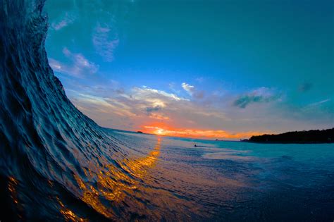 Multicoloured Wave Breaking Sunset Starsurfcamps