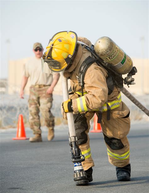 firefighters with the u s air force and qatar emiri air force complete a firefighter combat