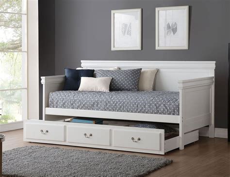 A simple traditional platform twin bed with a castered twin trundle bed. Bailee Daybed w/ Trundle (White) in 2020 | Twin daybed ...