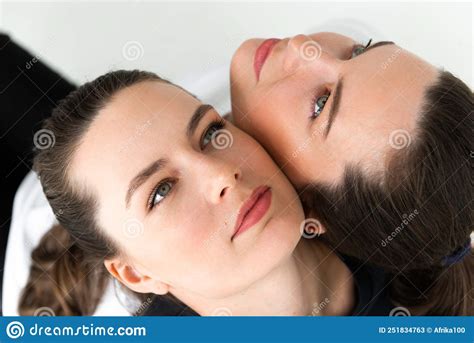Two Beautiful Women Twin Sisters Close Up Face Portrait Stock Image