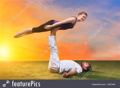 This means you're uniting your mind, body, and spirit, but you can certainly use yoga to unite yourself with your friend, partner, or even. Two People In Yoga Pose At Sunset Image