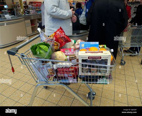 Customers With Full Supermarket Trolley Cart In Aldi Store Wales Uk