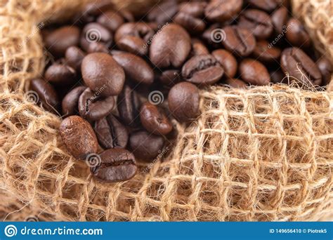 Raw Jute Sack And Well Burnt Coffee Beans Fragrant Coffee Stored In A