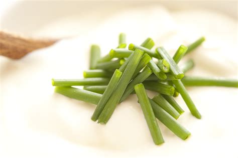 Chopped Fresh Green Chives On Sour Cream Free Stock Image