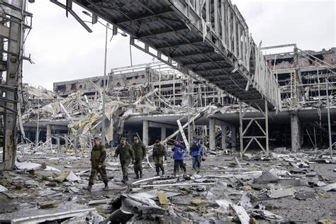 Pro Russian Separatists Together With Osce Observers At The Destroyed Donetsk International
