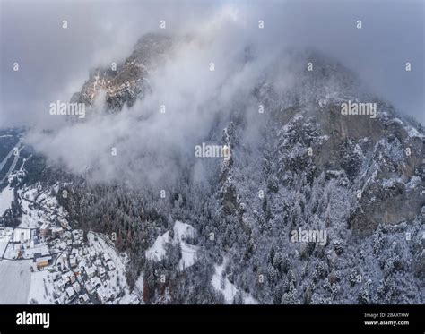 Aerial View Of Mountain With Boundary Tower Forest Underneath Fog