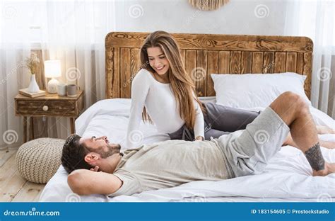 Man And Woman Talking In Bed In Bedroom Interior Stock Image Image Of