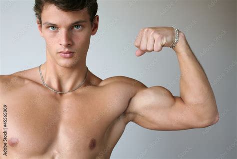 Muscular Man Flexing His Biceps Stock Photo Adobe Stock
