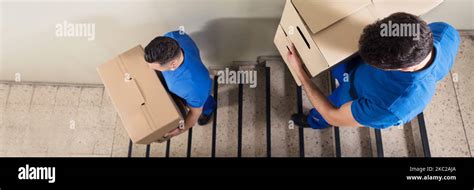 Man Carrying Boxes Down Stairs Hi Res Stock Photography And Images Alamy