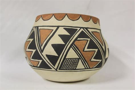 A Ceramic Bowl With Geometric Designs On It