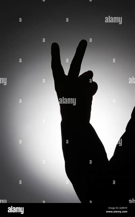 Silhouette Of Male Hand Making Rude Offensive V Sign Gesture With Two